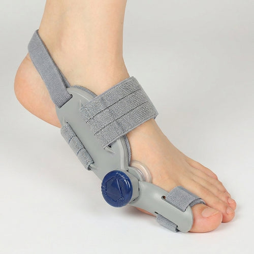 Archwell adjustable bunion splint worn on a foot, seen from the arch side